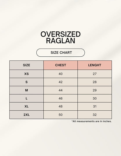 Frolic Saga unisex oversized raglan size chart with chest and length measurements in inches for sizes XS to 2XL