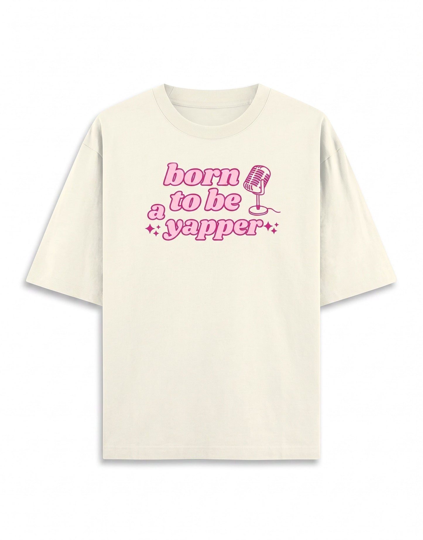 Frolic Saga cream 100% cotton oversized t-shirt with pink "born to be a yapper" graphic and microphone.