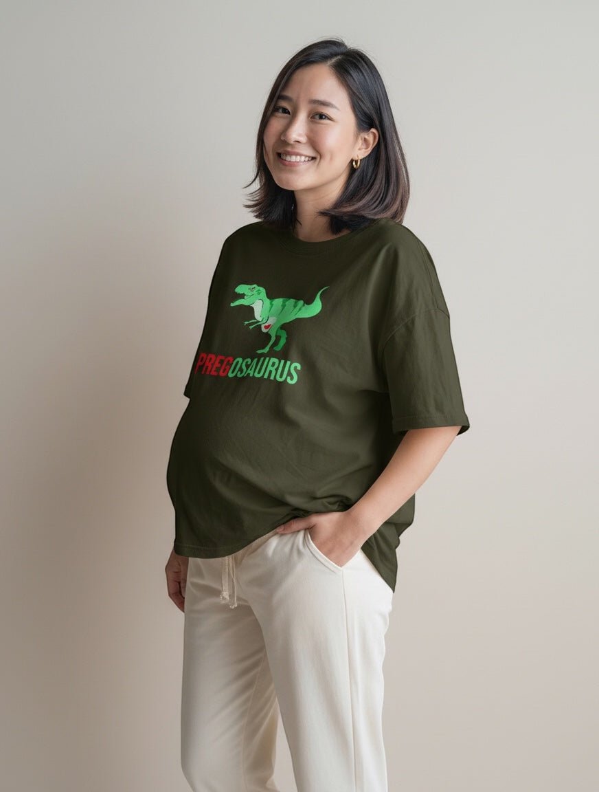 Frolic Saga olive green 100% cotton oversized t-shirt with a "PREGOSAURUS" graphic and a pregnant woman wearing it.
