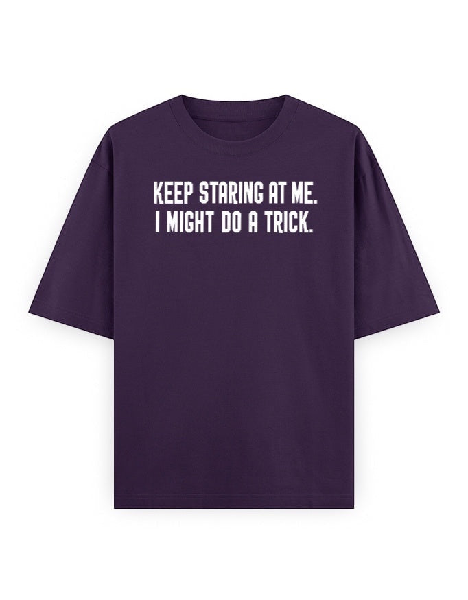 Frolic Saga Unisex oversized classic t-shirt in deep purple, 100% cotton with white text graphic "KEEP STARING AT ME. I MIGHT DO A TRICK."