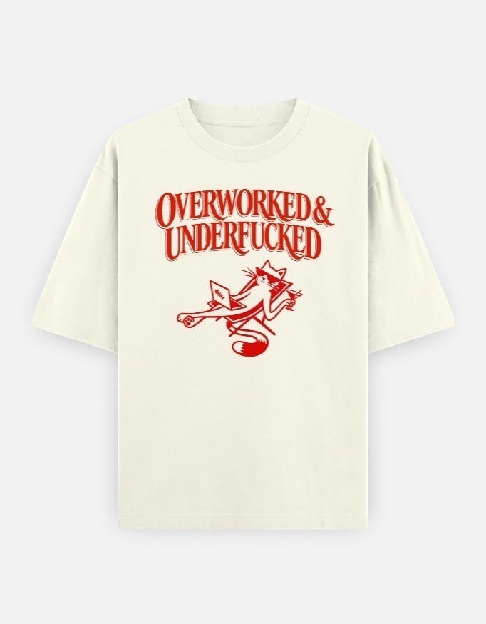 Frolic Saga off-white 100% cotton oversized t-shirt with red graphic text "Overworked & Underfucked" and a cat illustration.