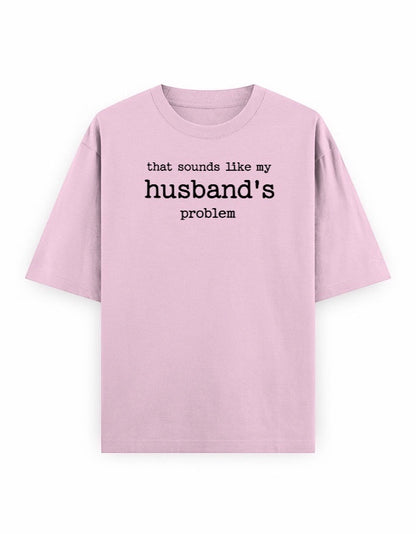 Frolic Saga light pink oversized 100% cotton t-shirt with black text graphic that says "that sounds like my husband's problem."
