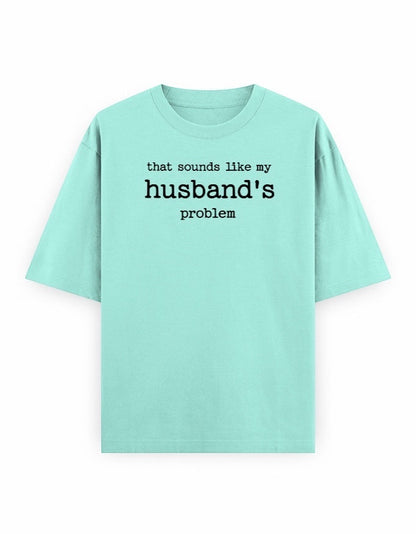 Frolic Saga light pink oversized 100% cotton t-shirt with black text graphic that says "that sounds like my husband's problem."