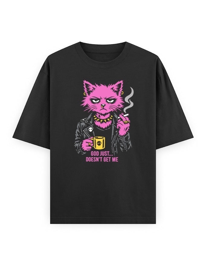 Frolic Saga black oversized cotton t-shirt with a punk graphic of a pink cat smoking and holding a mug, text reads "God Just... Doesn't Get Me."