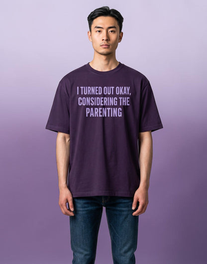 Frolic Saga unisex oversized purple cotton t-shirt with I Turned Out Okay Considering The Parenting slogan print