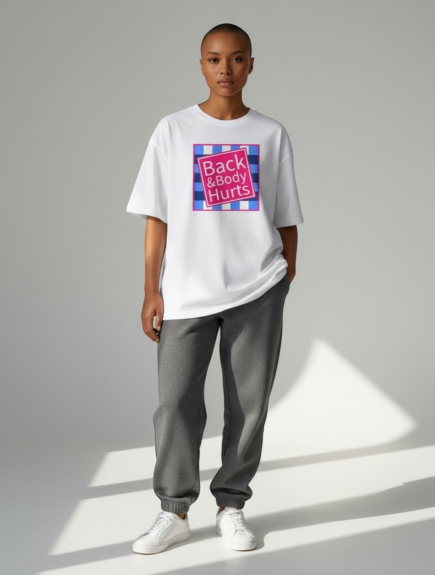 Frolic Saga white oversized 100% cotton t-shirt with "Back & Body Hurts" graphic print on a model.