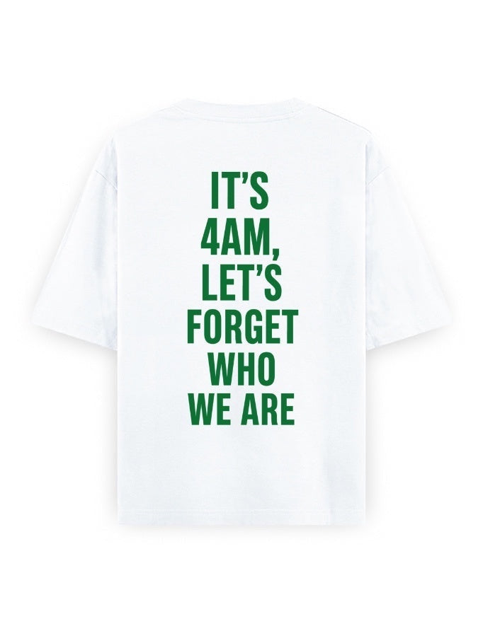 Frolic Saga white 100% cotton oversized t-shirt with green text graphic on back reading "IT'S 4AM, LET'S FORGET WHO WE ARE".
