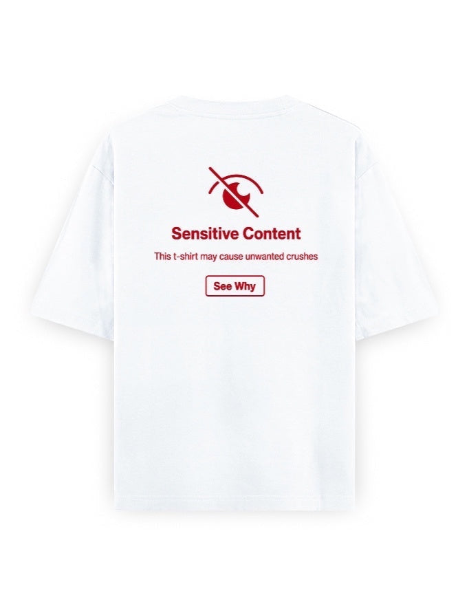 Frolic Saga white 100% cotton oversized t-shirt with red 'Sensitive Content' graphic and 'See Why' button.
