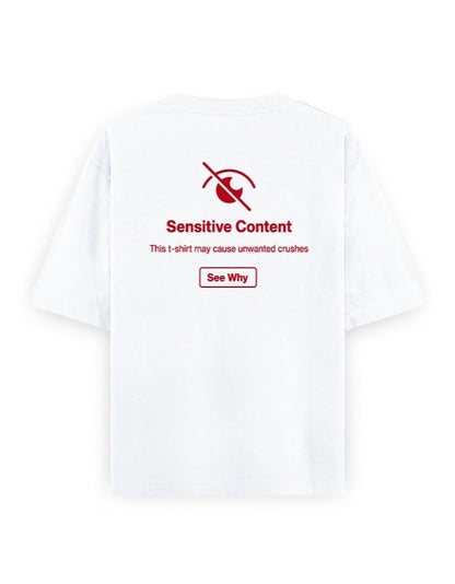 Frolic Saga white 100% cotton oversized t-shirt with red 'Sensitive Content' graphic and 'See Why' button.