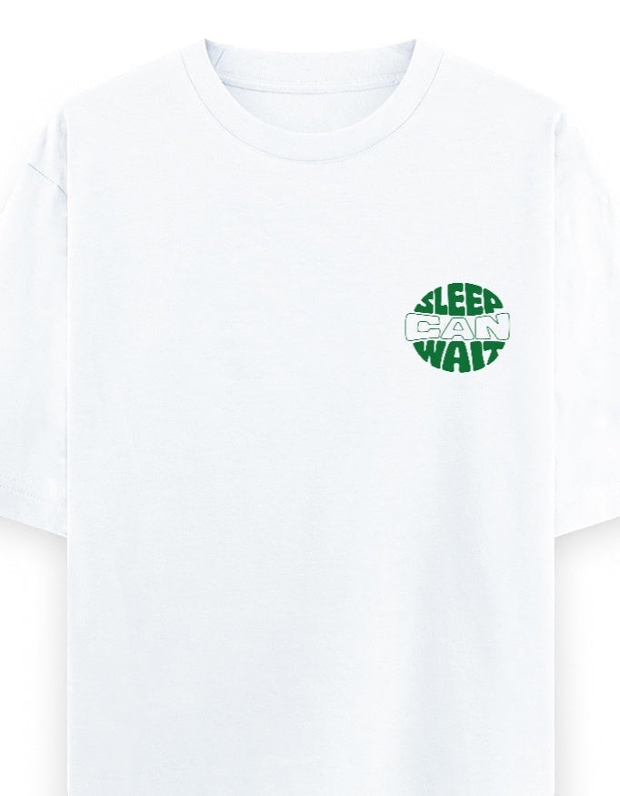 Frolic Saga white 100% cotton oversized t-shirt with green 'Sleep Can Wait' graphic on left chest.