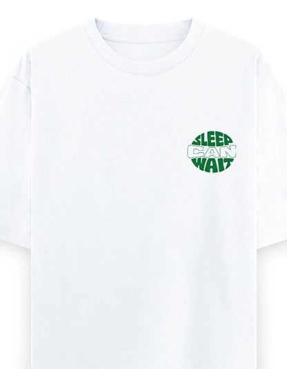 Frolic Saga white 100% cotton oversized t-shirt with green 'Sleep Can Wait' graphic on left chest.
