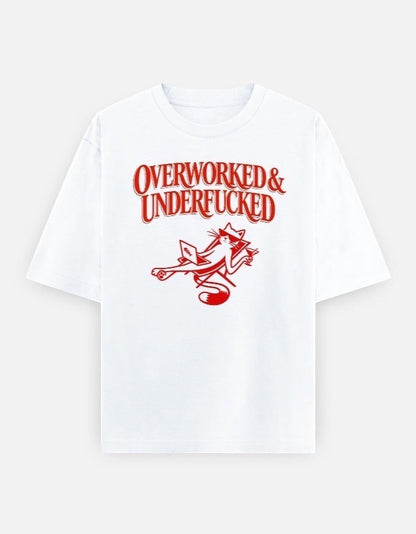 Frolic Saga white oversized cotton t-shirt with red graphic text "Overworked & Underfucked" and a cat illustration.
