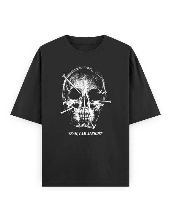 Yeah, I Am Alright black oversized tee, front distressed skull with nails graphic and white text - Frolic Saga